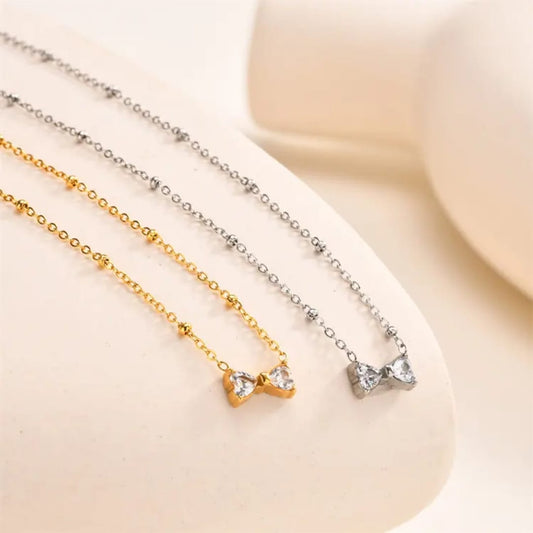 SERAPHIC BOW CHARM DUO – NECKLACE BRACELET COMBO